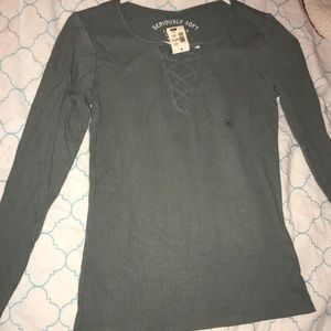 A grey long sleeve fitted shirt